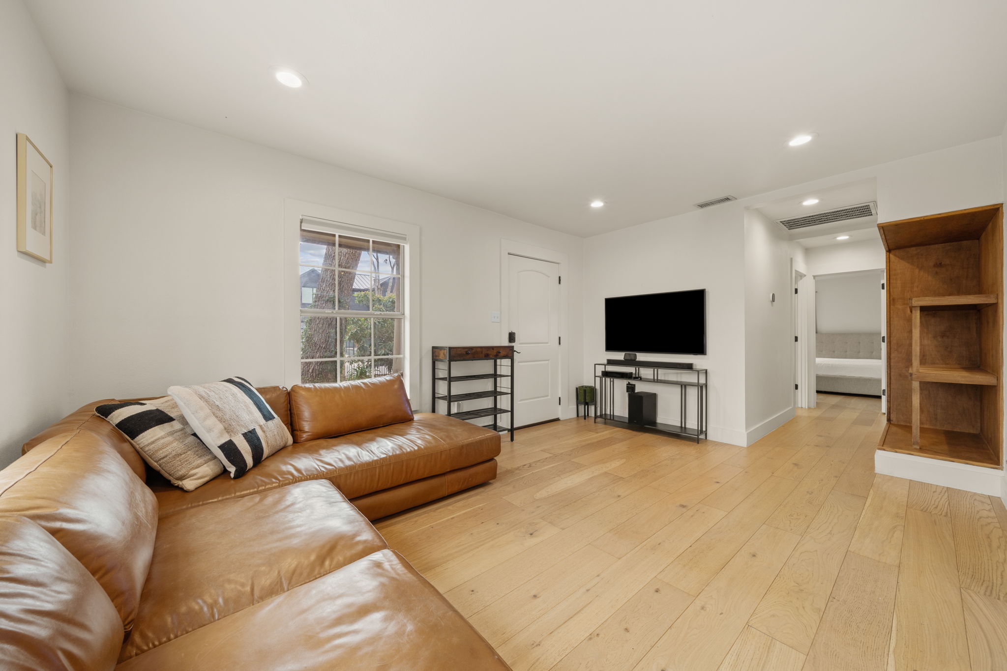 912 Mansell Avenue Austin, TX 78702 - Photo 7 of 37 Living area with recessed lighting and light wood finished floors