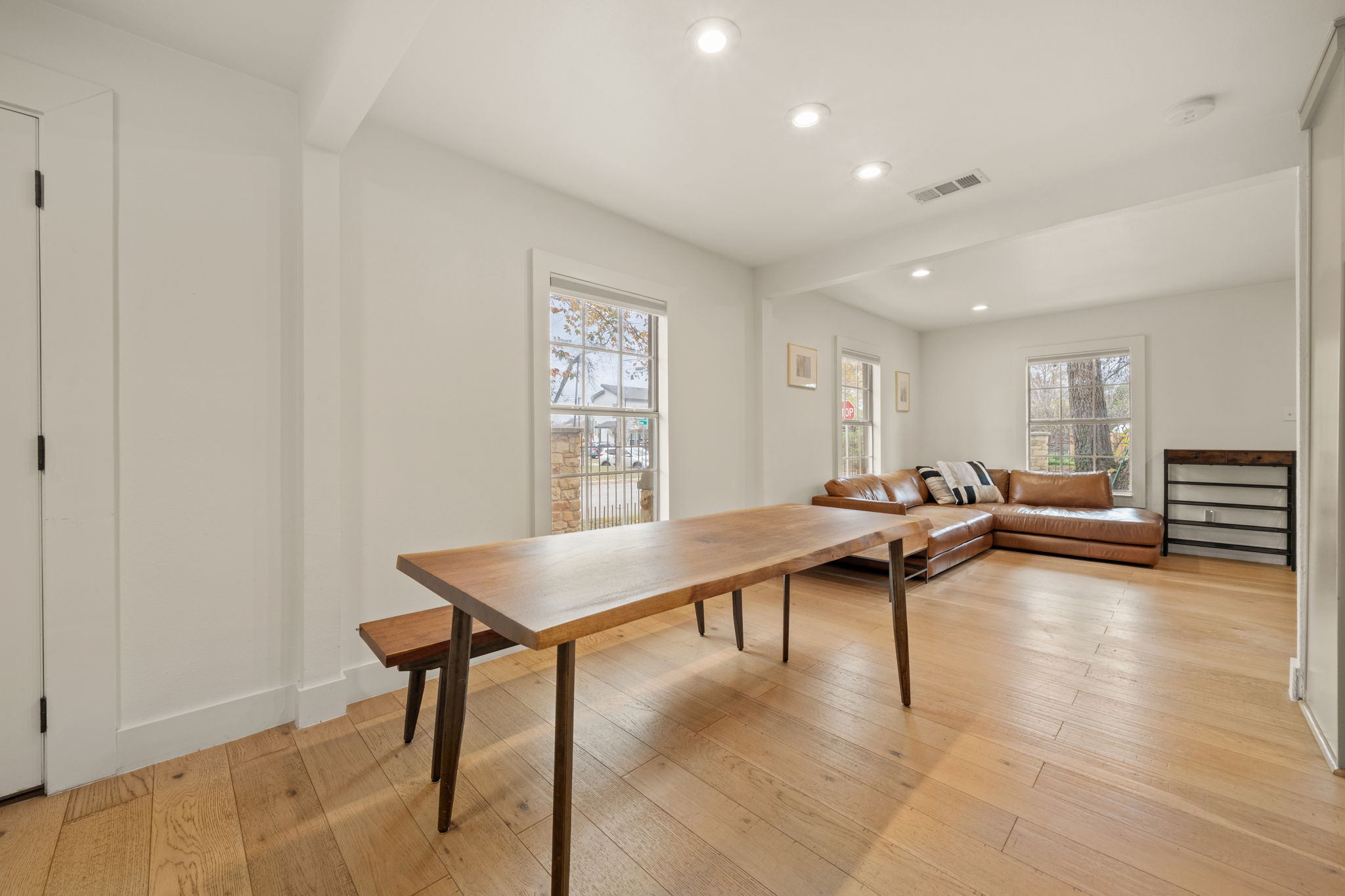 912 Mansell Avenue Austin, TX 78702 - Photo 9 of 37 Dining room with recessed lighting, light wood-style floors, and beamed ceiling