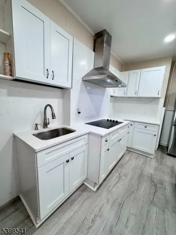 a kitchen with cabinets a sink and appliances
