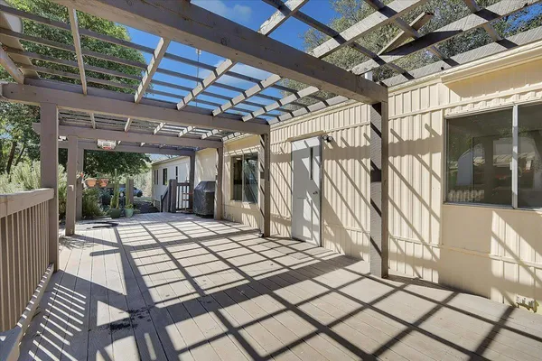 a view of a porch with wooden floor