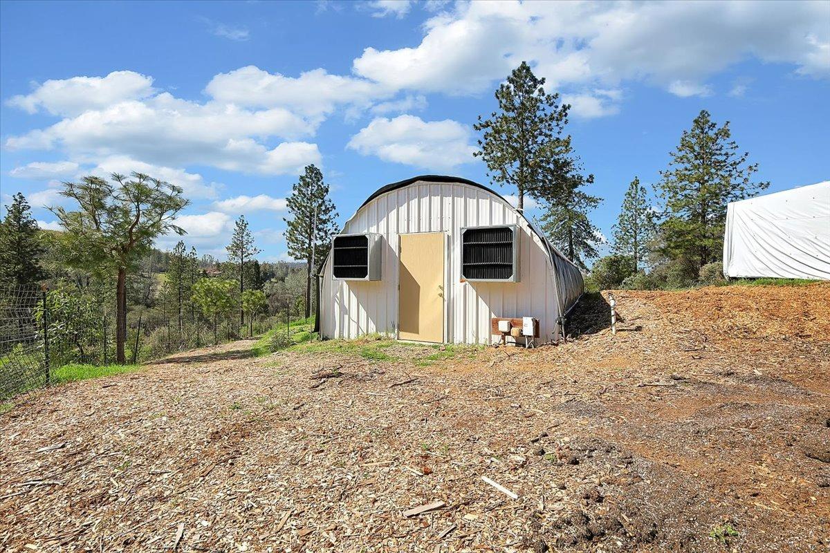 23003 Pleasant Valley Road North San Juan, CA 95960 - Photo 41 of 47 a front view of a house with a yard