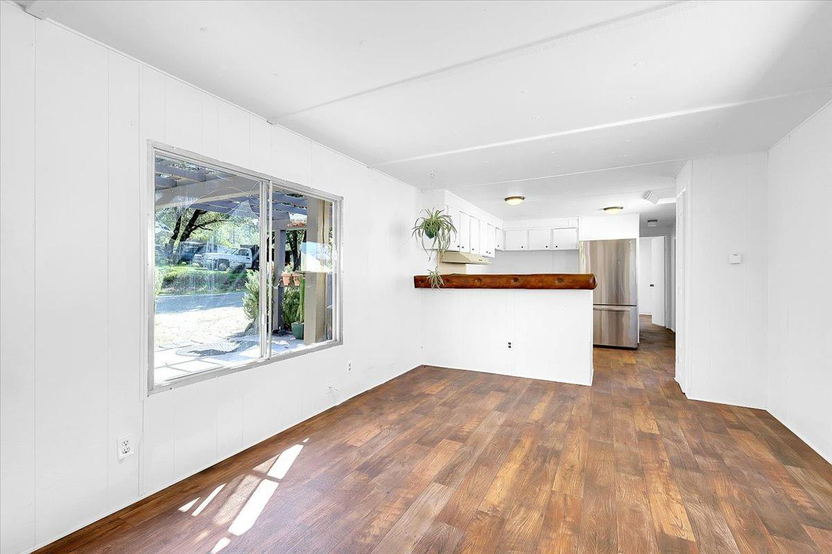 23003 Pleasant Valley Road North San Juan, CA 95960 - Photo 6 of 47 a view of a big room with wooden floor and windows