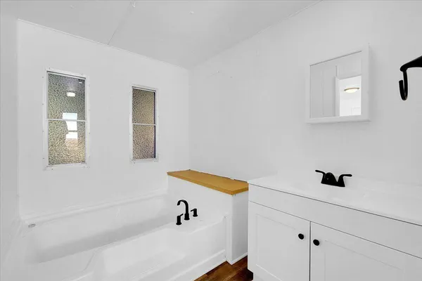 a bathroom with a bathtub and shower