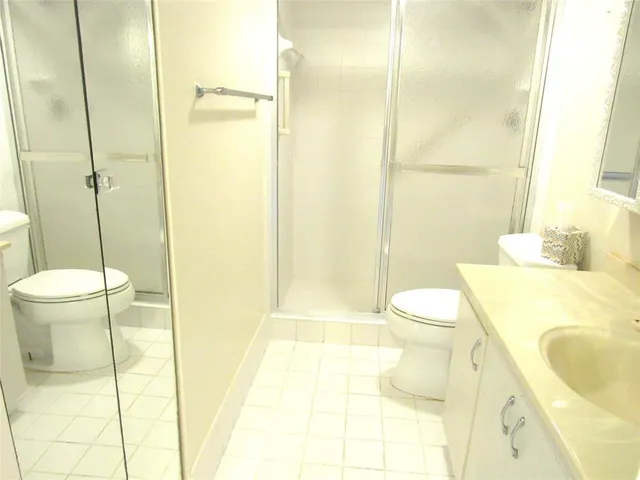 a bathroom with a sink and toilet