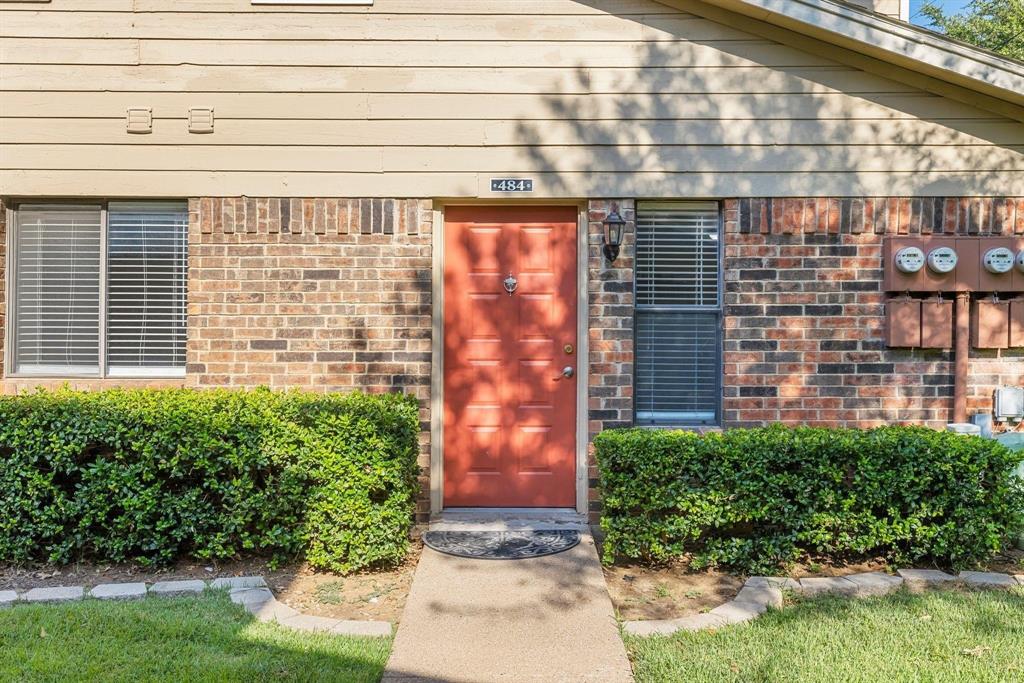 2240 Tarpley Road, Unit 484 Carrollton, TX 75006 - Photo 3 of 20 a front view of a building with garden