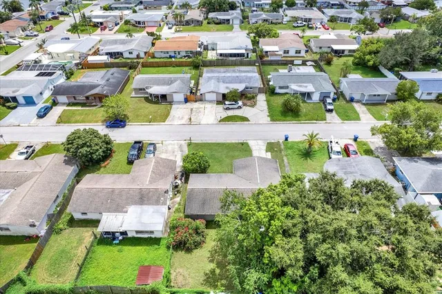 an aerial view of residential houses with outdoor space