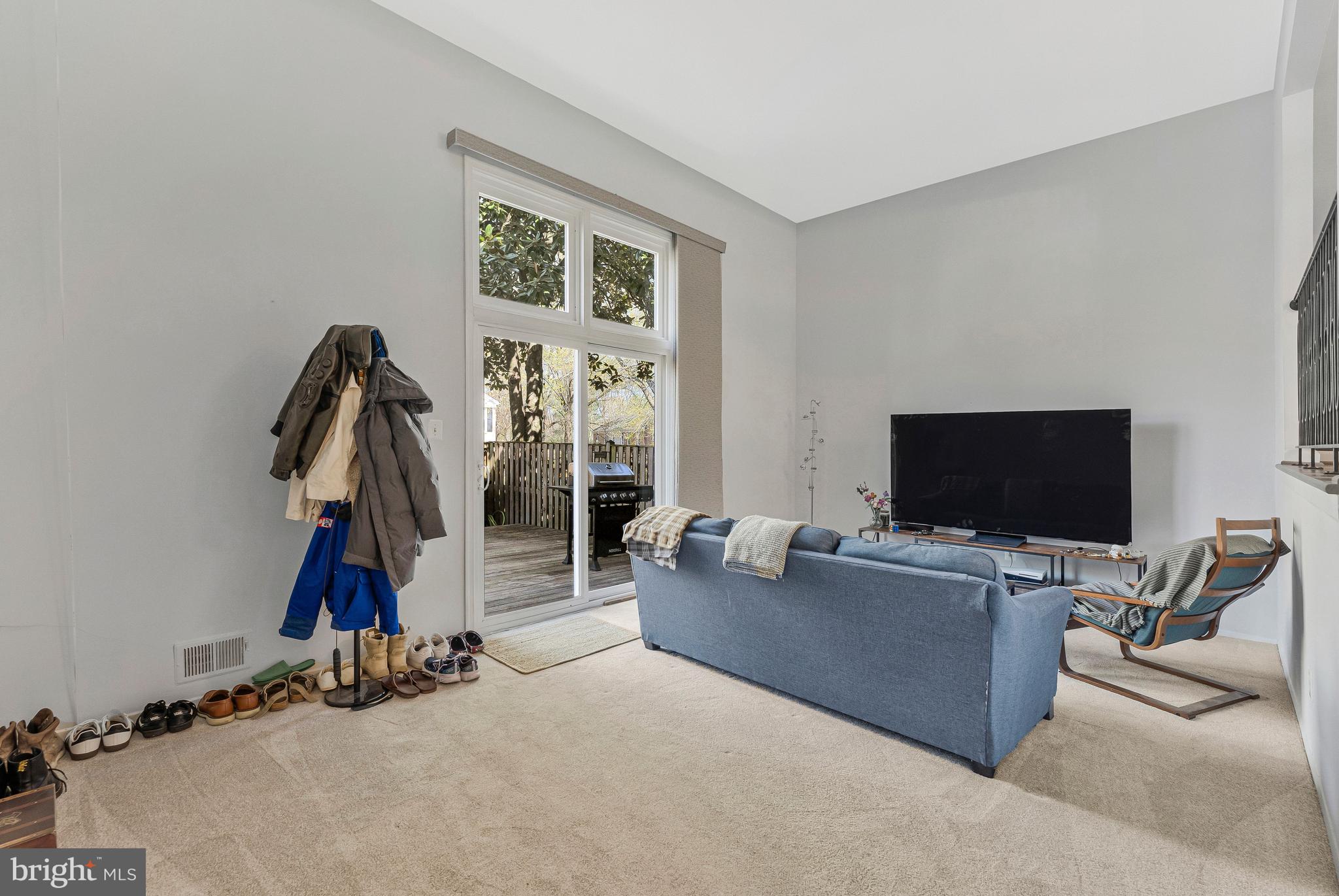 11852 St Trinians Court Reston, VA 20191 - Photo 11 of 48 Living room w/ sliding glass door to deck