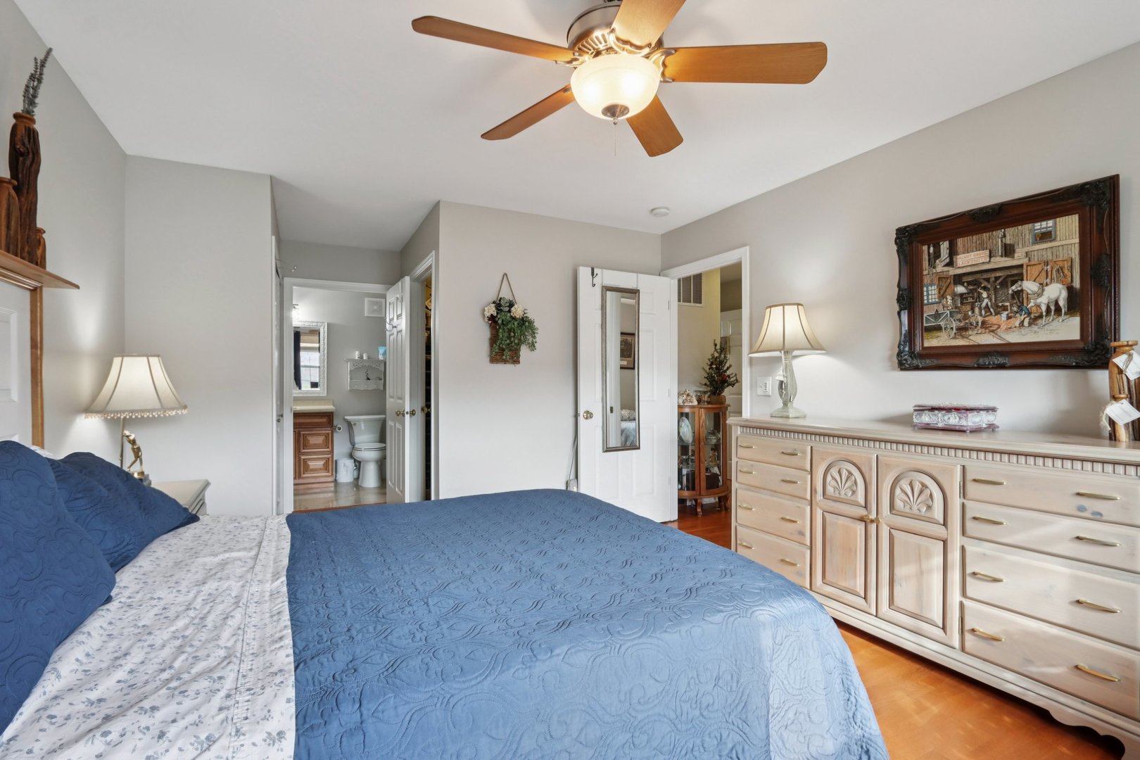 1279 Merrimack Court Crystal Lake, IL 60014 - Photo 15 of 27 a spacious bedroom with a large bed and a chandelier