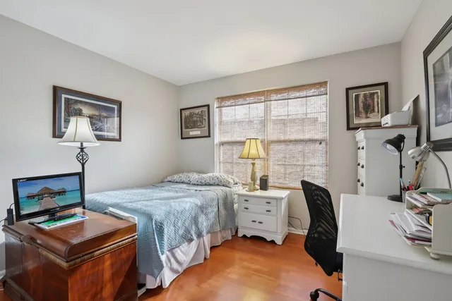 a bedroom with two beds and a window