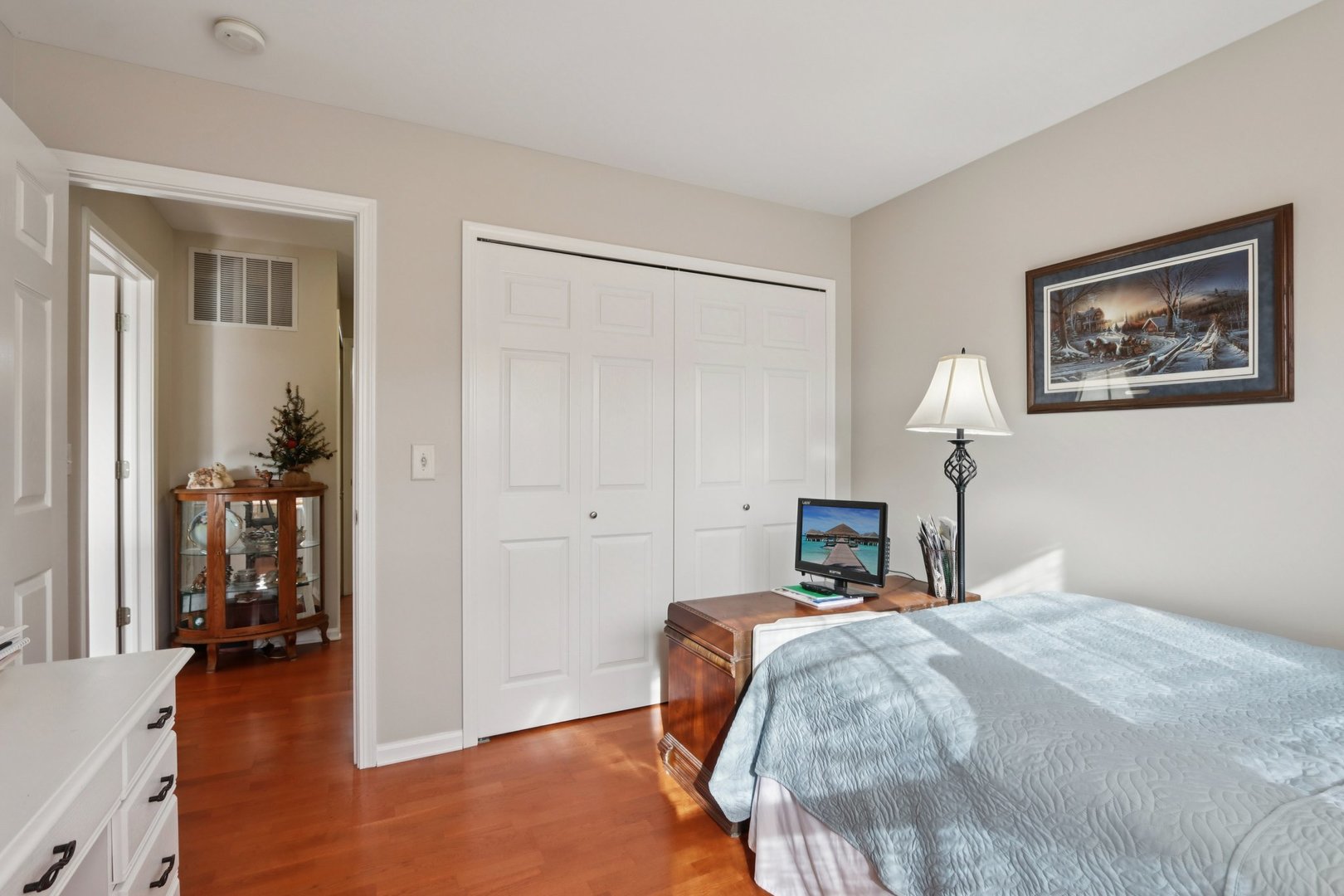 1279 Merrimack Court Crystal Lake, IL 60014 - Photo 19 of 27 a bedroom with a bed and a chandelier