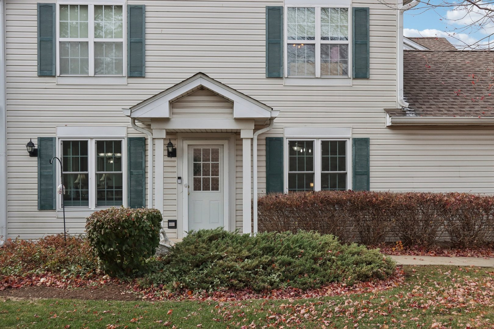 1279 Merrimack Court Crystal Lake, IL 60014 - Photo 24 of 27 a front view of a house with garden