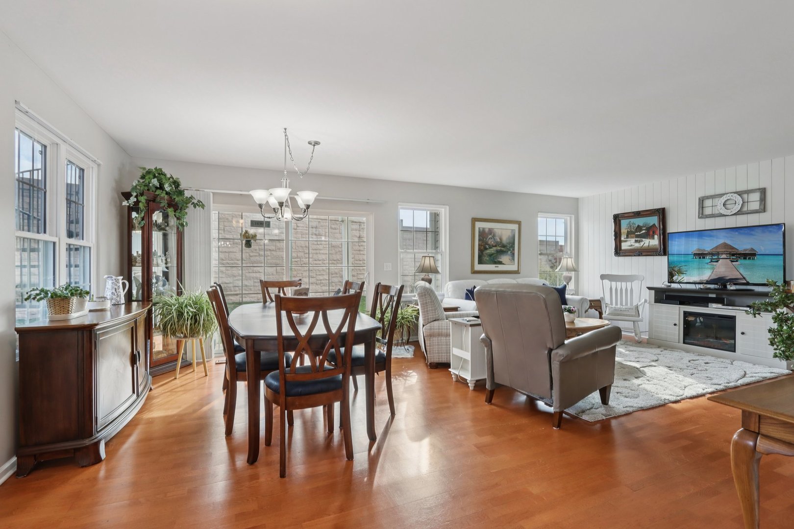 1279 Merrimack Court Crystal Lake, IL 60014 - Photo 6 of 27 a view of a dining room with furniture and wooden floor