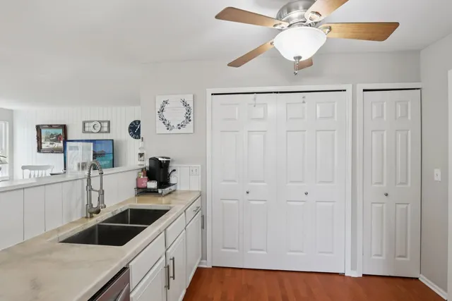 a kitchen with a sink and cabinets