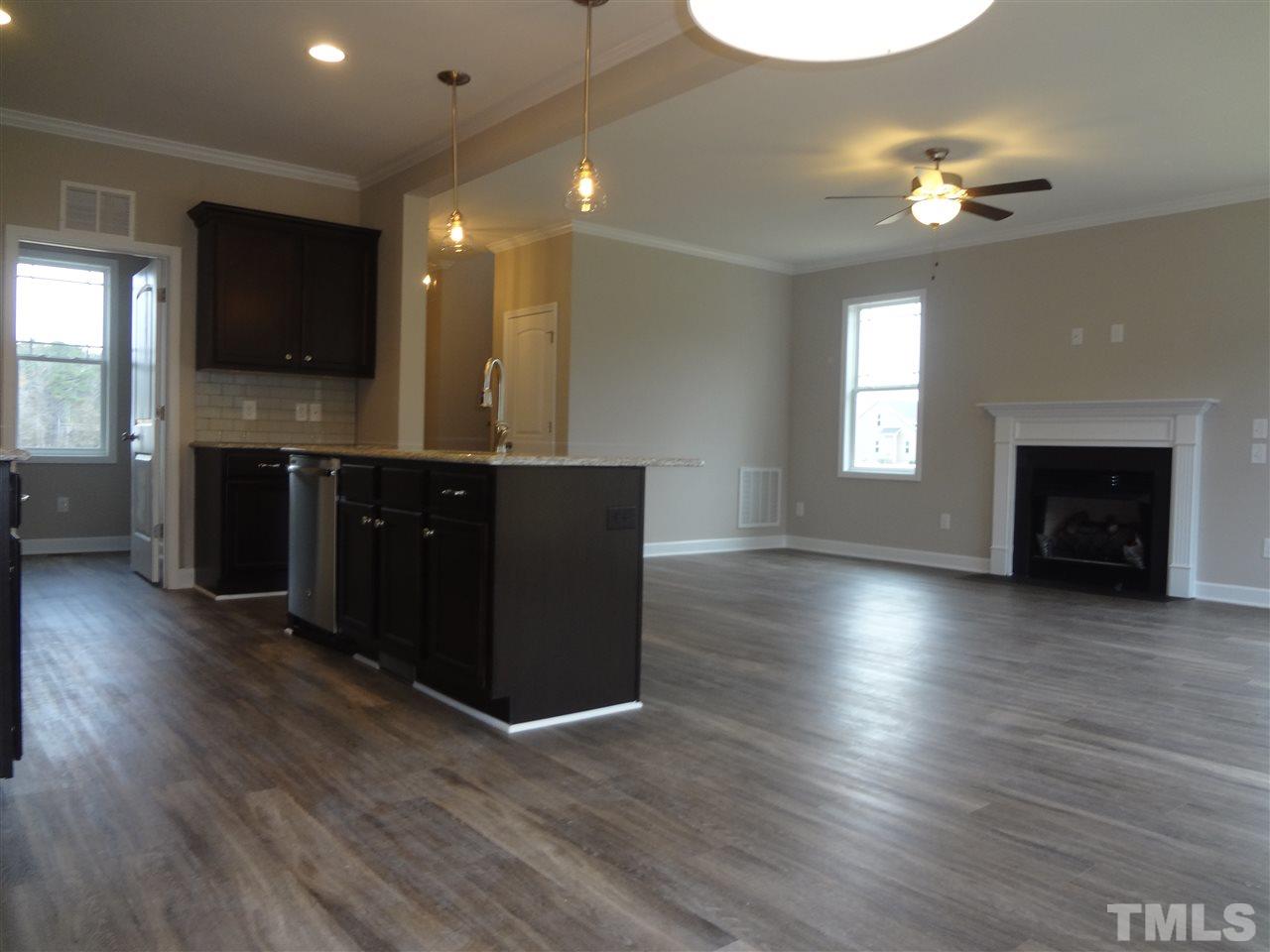 7932 Creech Road Middlesex, NC 27557 - Photo 14 of 25 a view of kitchen and hall with wooden floor