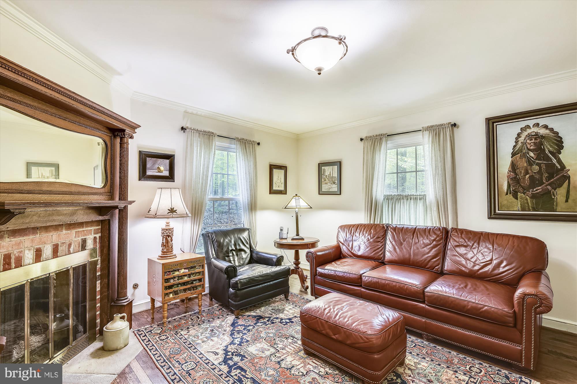 11615 Springtime Lane Fairfax Station, VA 22039 - Photo 19 of 38 a living room with furniture a fireplace and a window