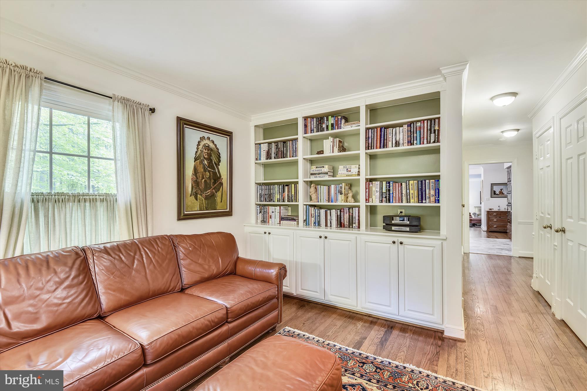 11615 Springtime Lane Fairfax Station, VA 22039 - Photo 20 of 38 a living room with furniture and a book shelf
