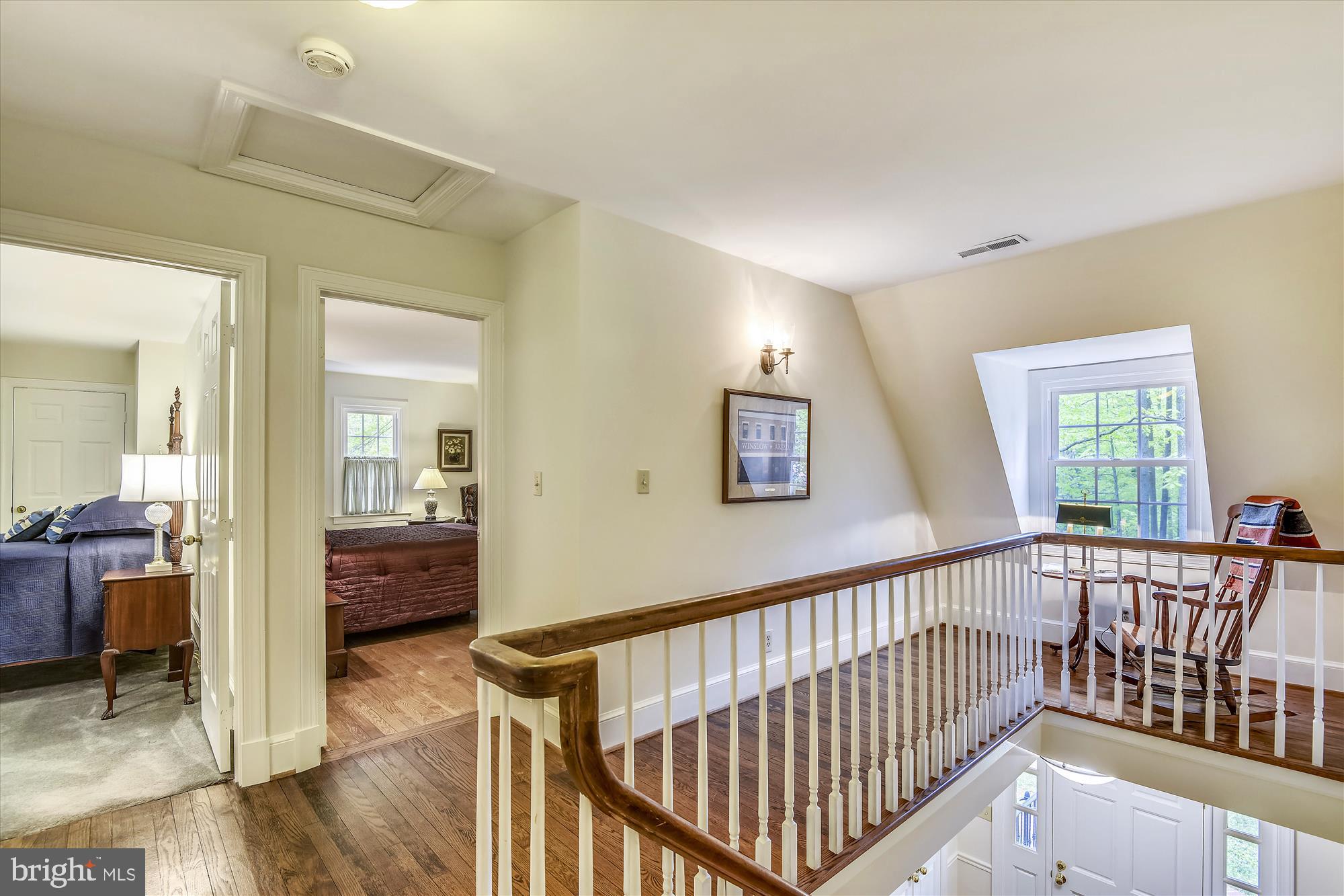 11615 Springtime Lane Fairfax Station, VA 22039 - Photo 26 of 38 a view of a hallway to a livingroom with wooden floor and furniture