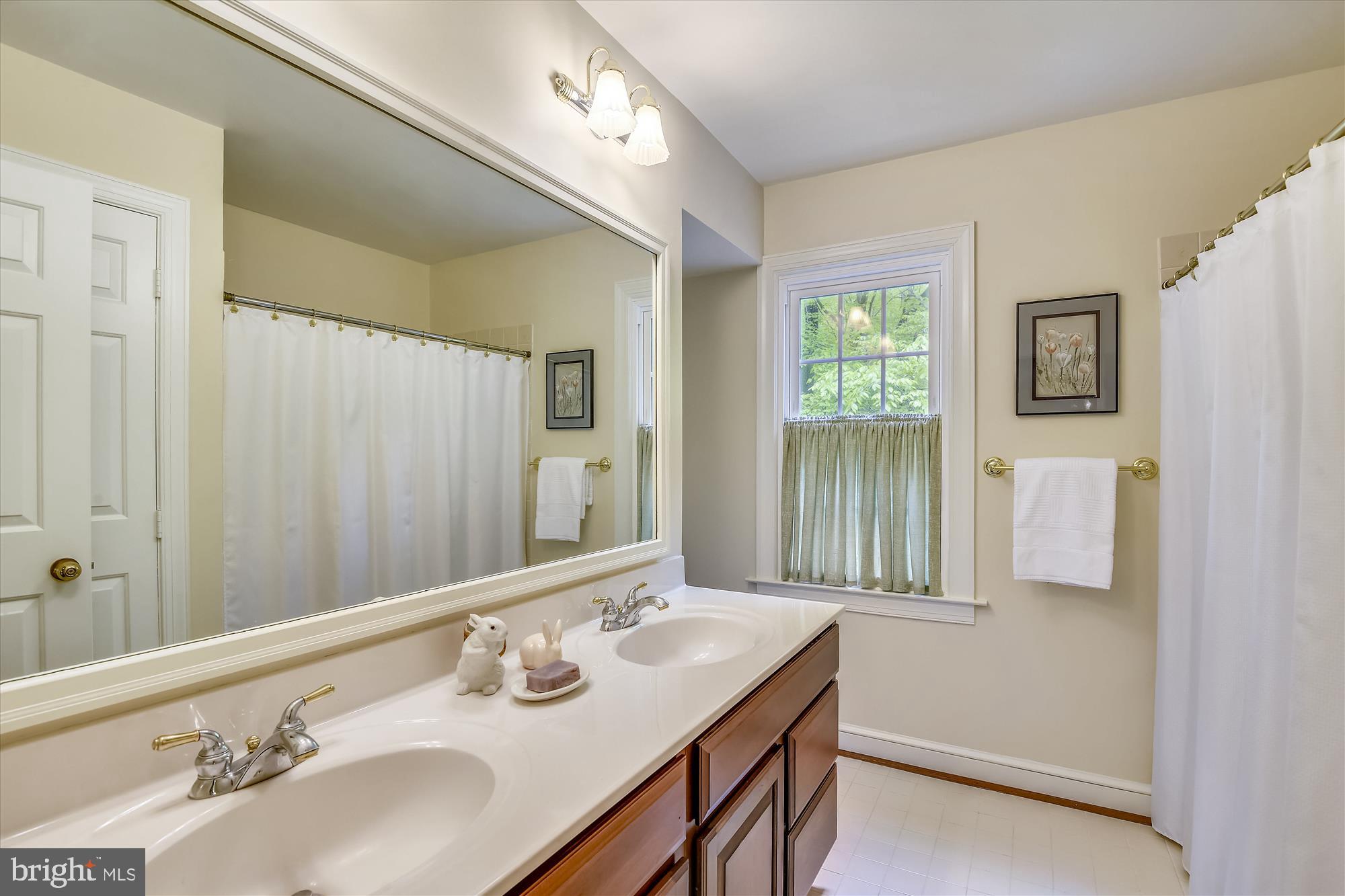 11615 Springtime Lane Fairfax Station, VA 22039 - Photo 31 of 38 a bathroom with a sink double vanity and a mirror