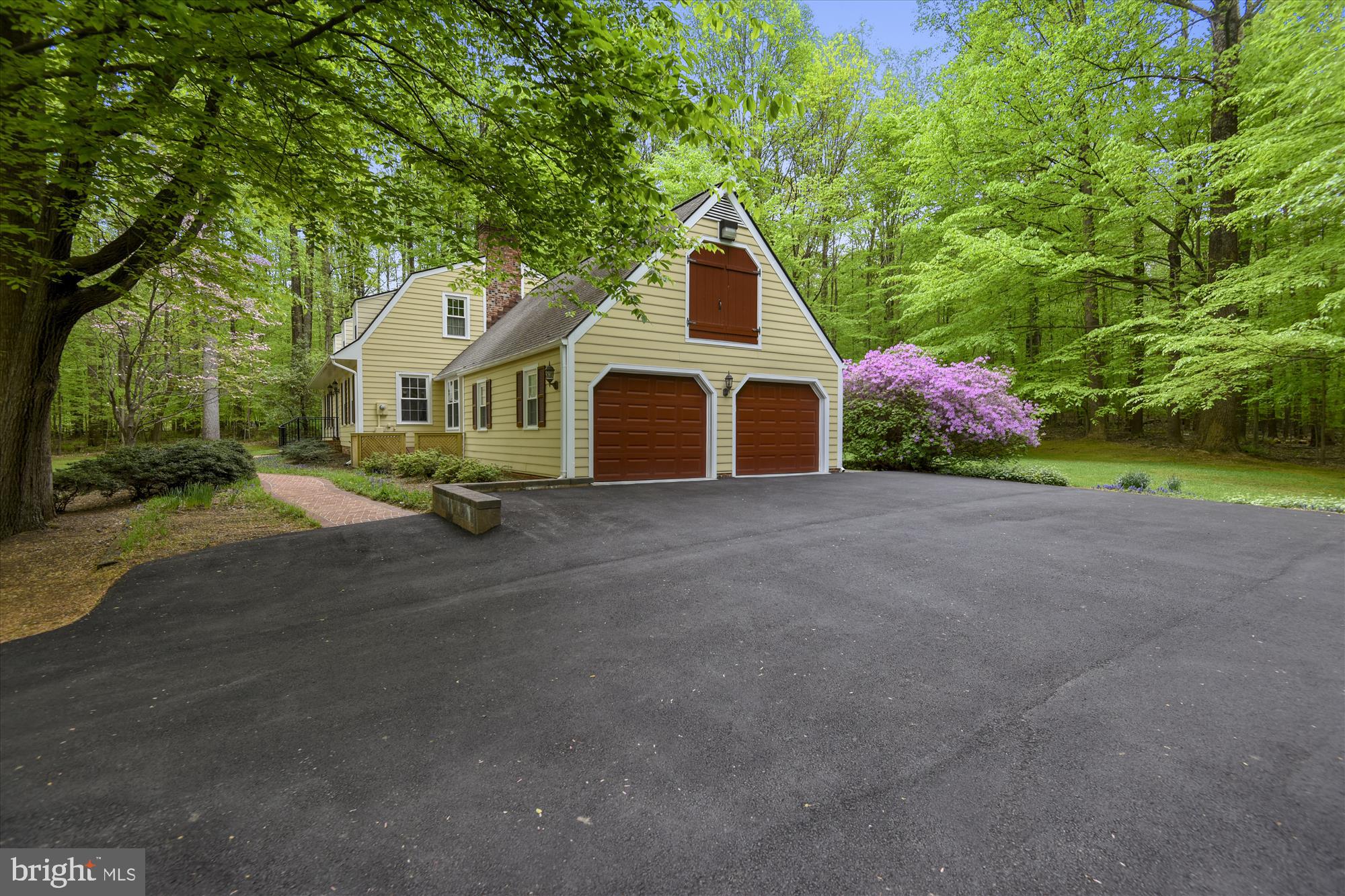 11615 Springtime Lane Fairfax Station, VA 22039 - Photo 36 of 38 a front view of a house with a yard and garage