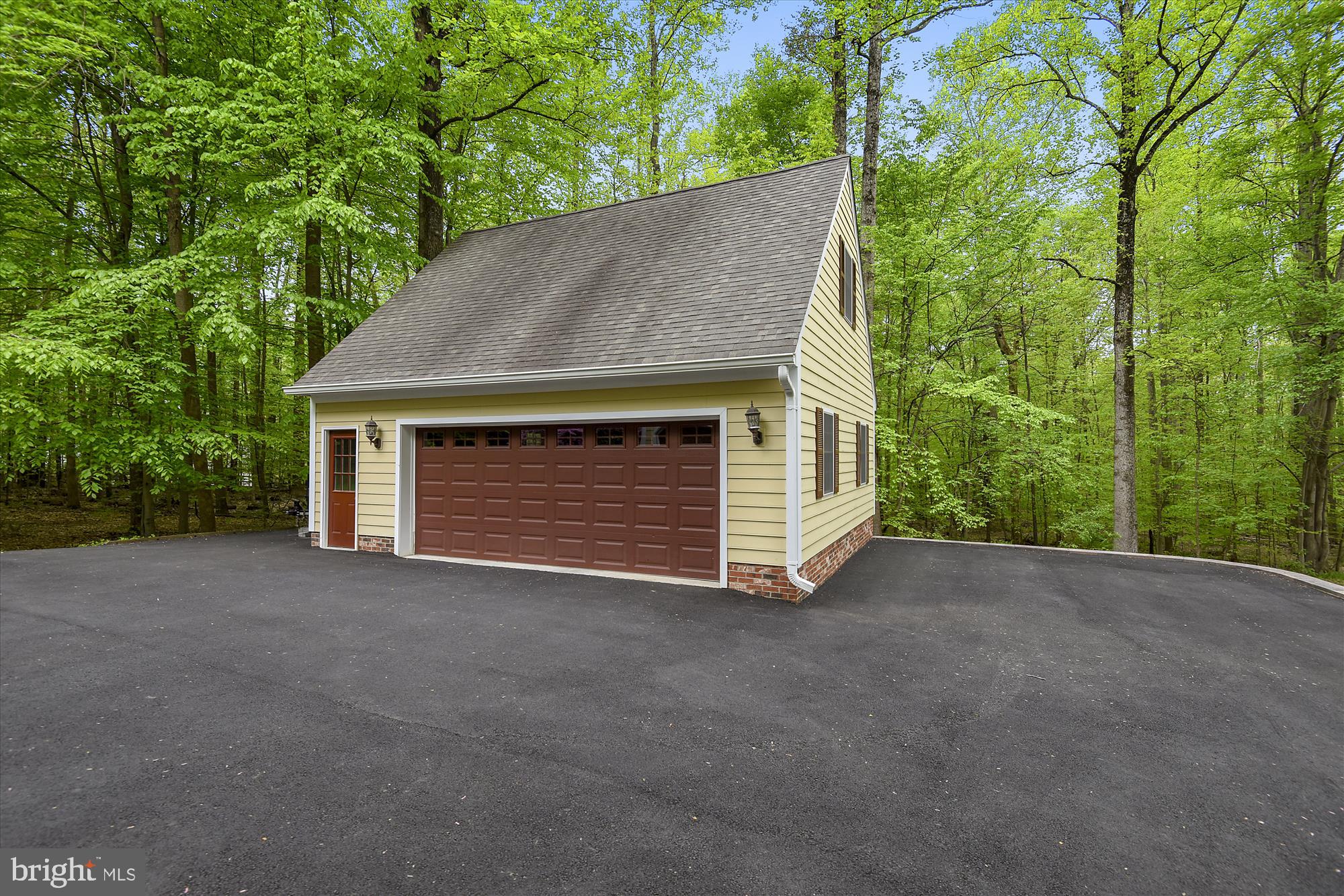 11615 Springtime Lane Fairfax Station, VA 22039 - Photo 38 of 38 a view of a house with a yard and garage
