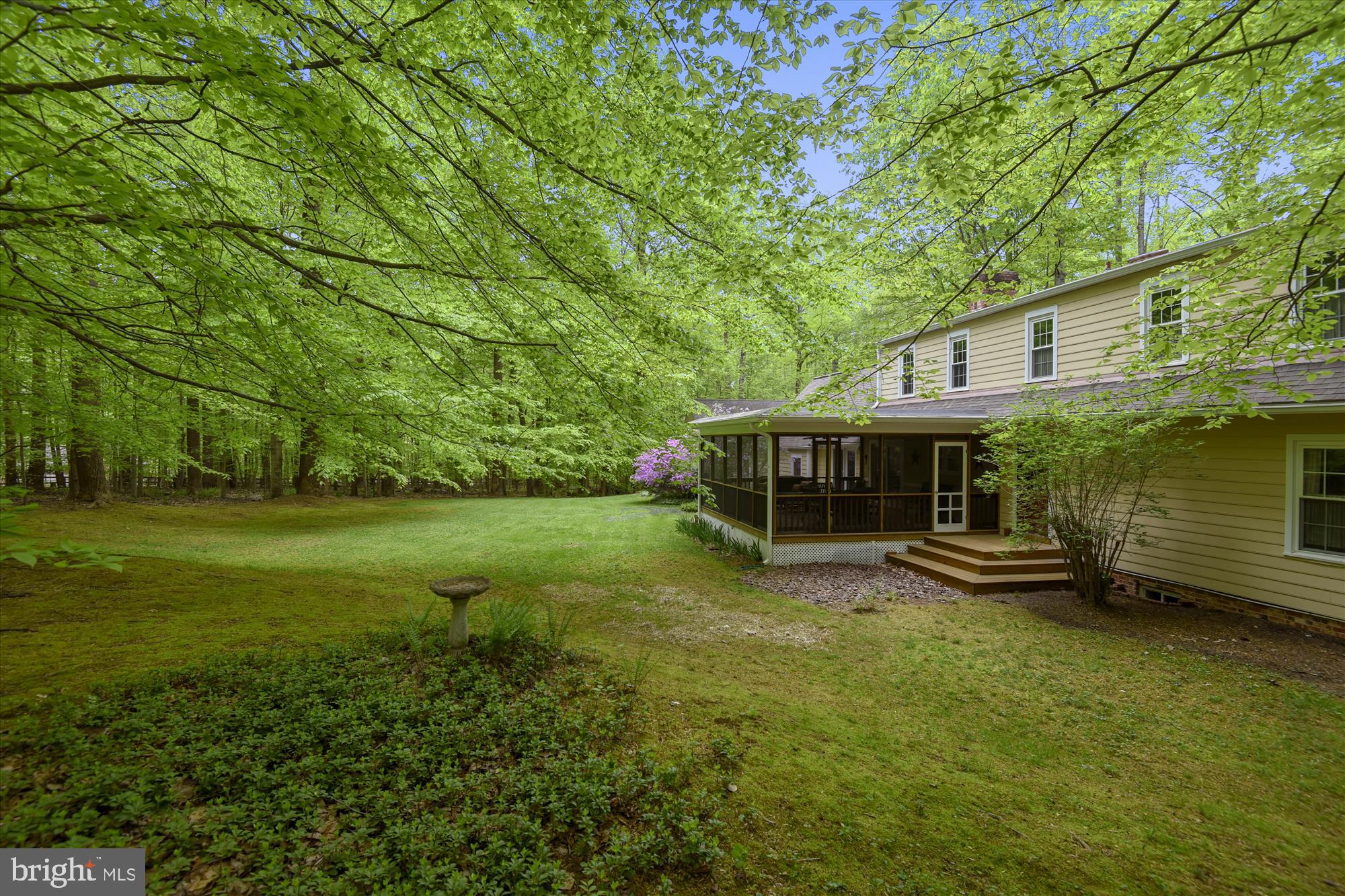 11615 Springtime Lane Fairfax Station, VA 22039 - Photo 5 of 38 a view of a house with a yard deck and a tree