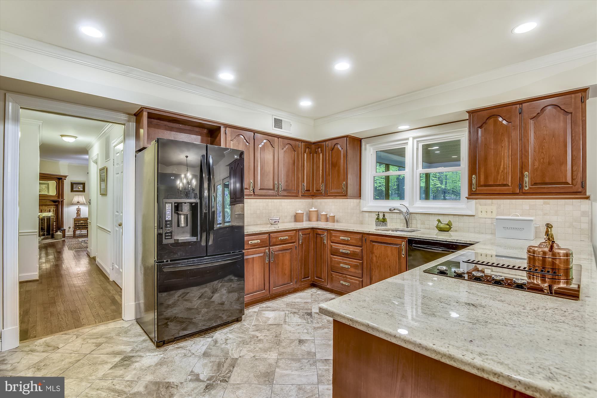 11615 Springtime Lane Fairfax Station, VA 22039 - Photo 9 of 38 a kitchen with stainless steel appliances granite countertop a refrigerator and a sink