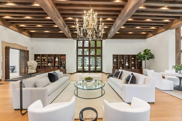 a kitchen with a sink a stove and a wooden floor
