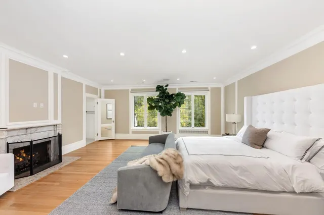 a large kitchen with stainless steel appliances a refrigerator and a stove top oven