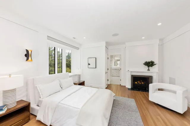 a view of a patio with a table and chairs under an umbrella