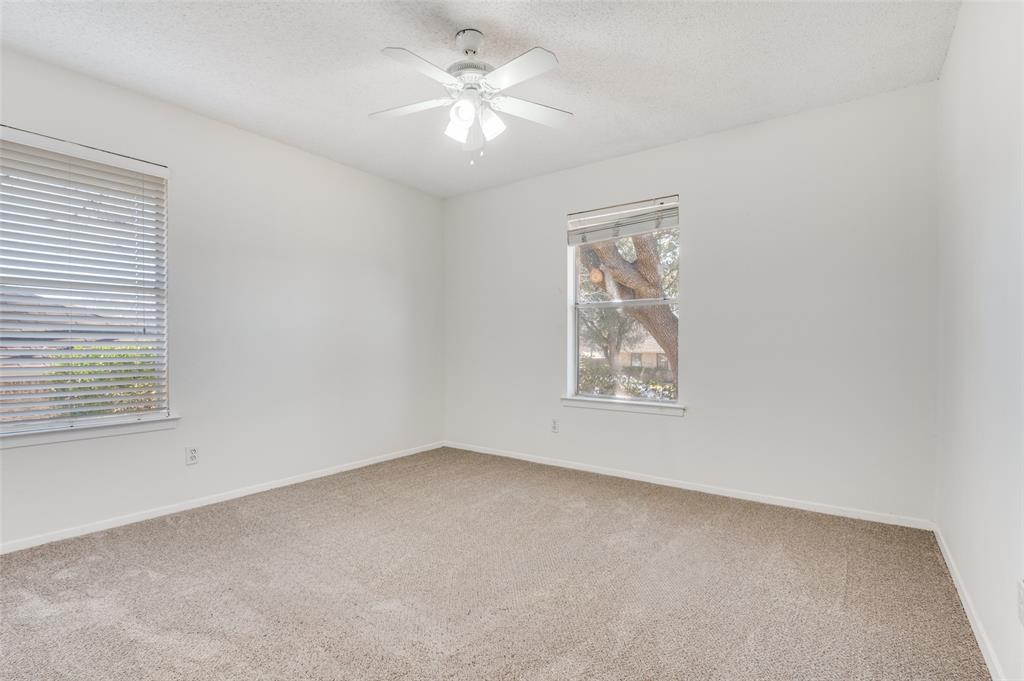 1308 Sundale Street Ennis, TX 75119 - Photo 6 of 12 an empty room with a window and a fan