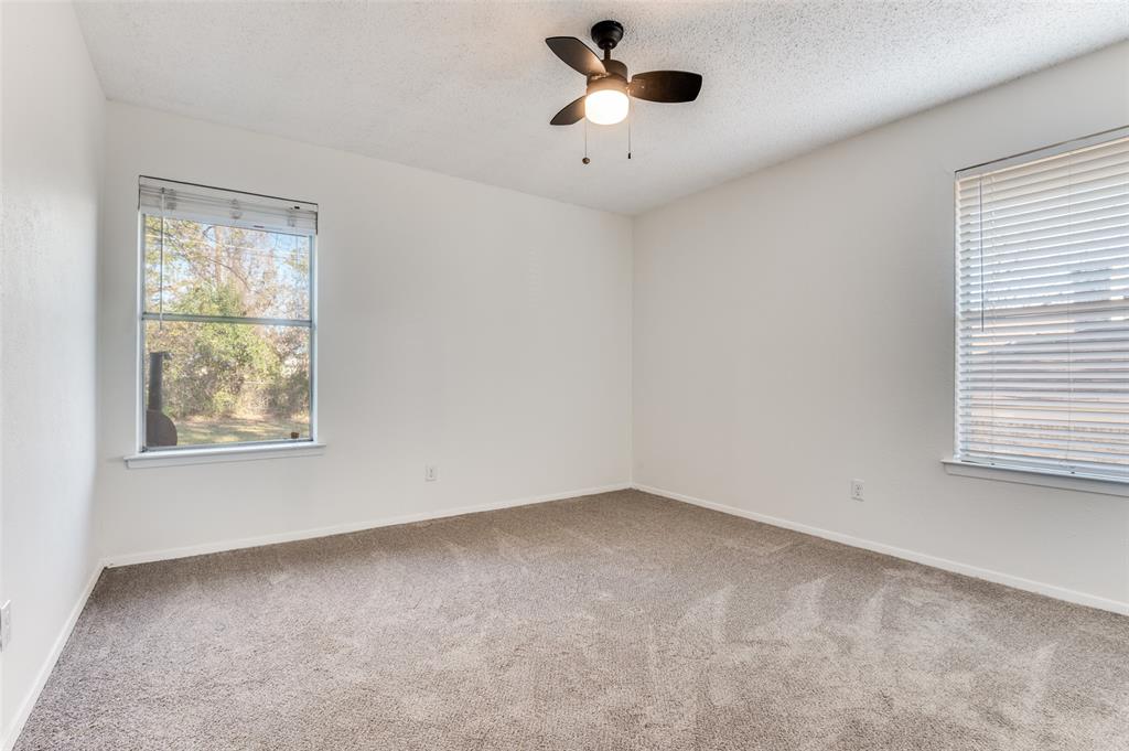 1308 Sundale Street Ennis, TX 75119 - Photo 8 of 12 an empty room with a window