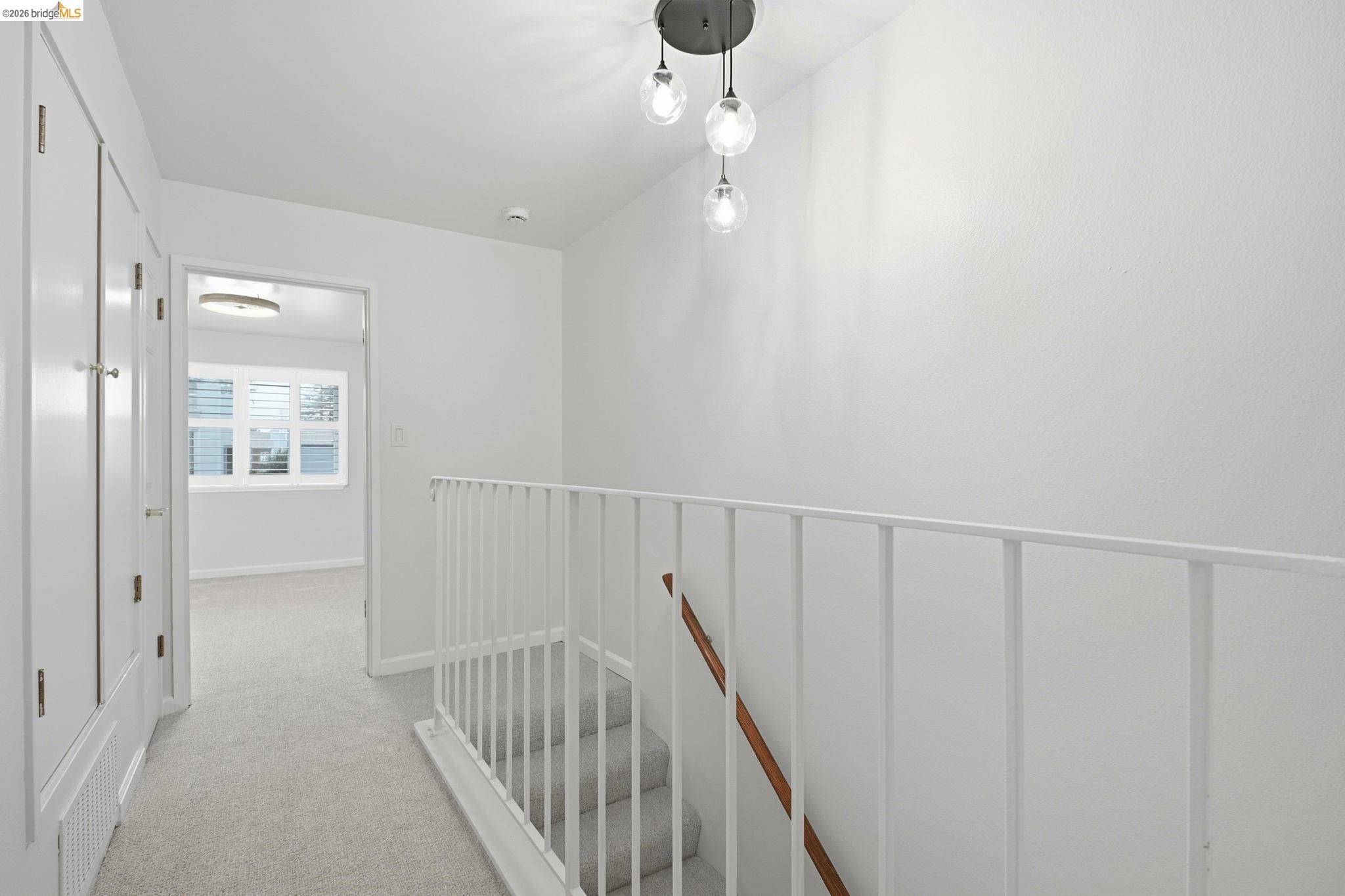18018 Sahara Road Hayward, CA 94541 - Photo 14 of 20 a view of a hallway with wooden floor and staircase