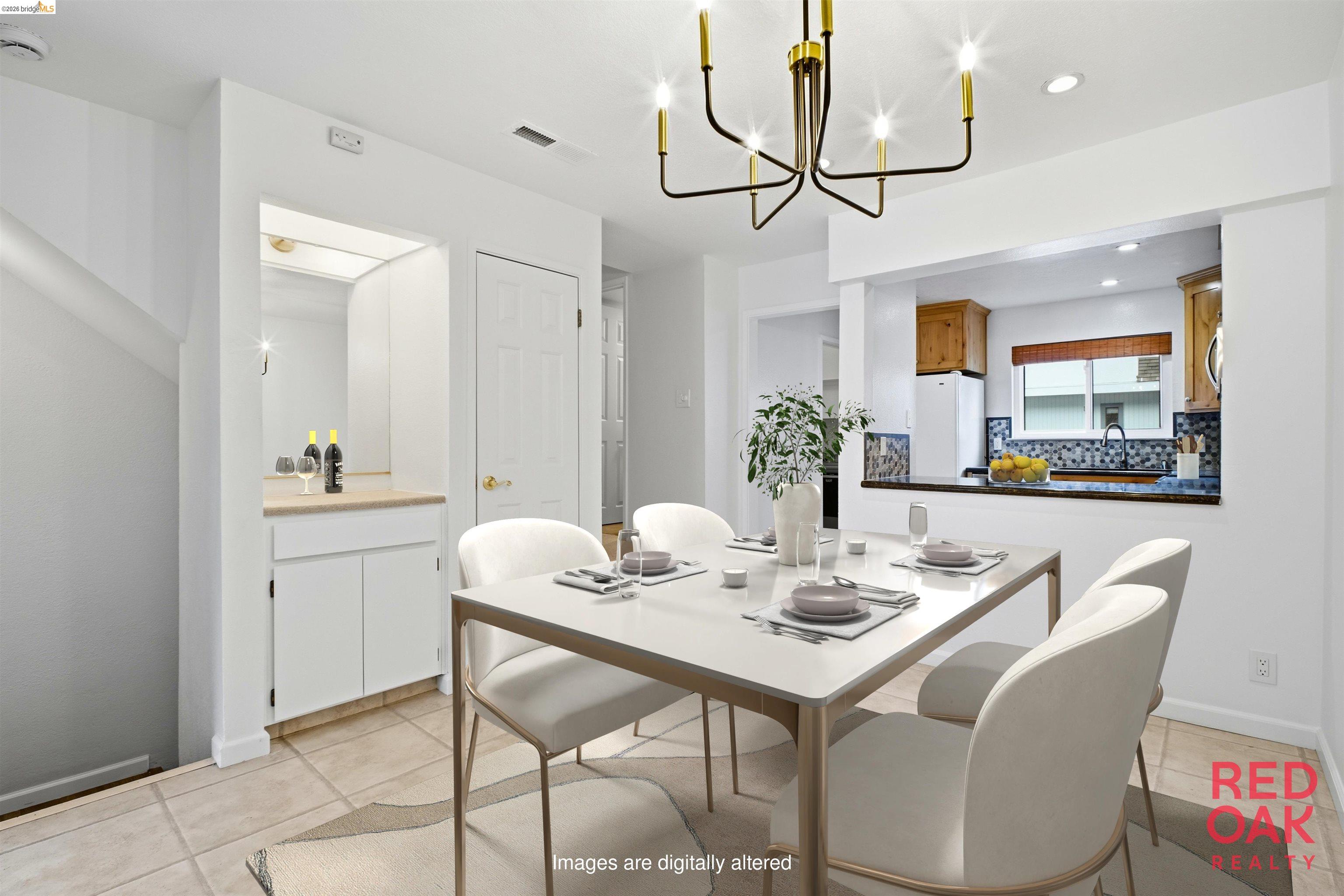 18018 Sahara Road Hayward, CA 94541 - Photo 5 of 20 a dining room with wooden floor a chandelier a wooden table and chairs