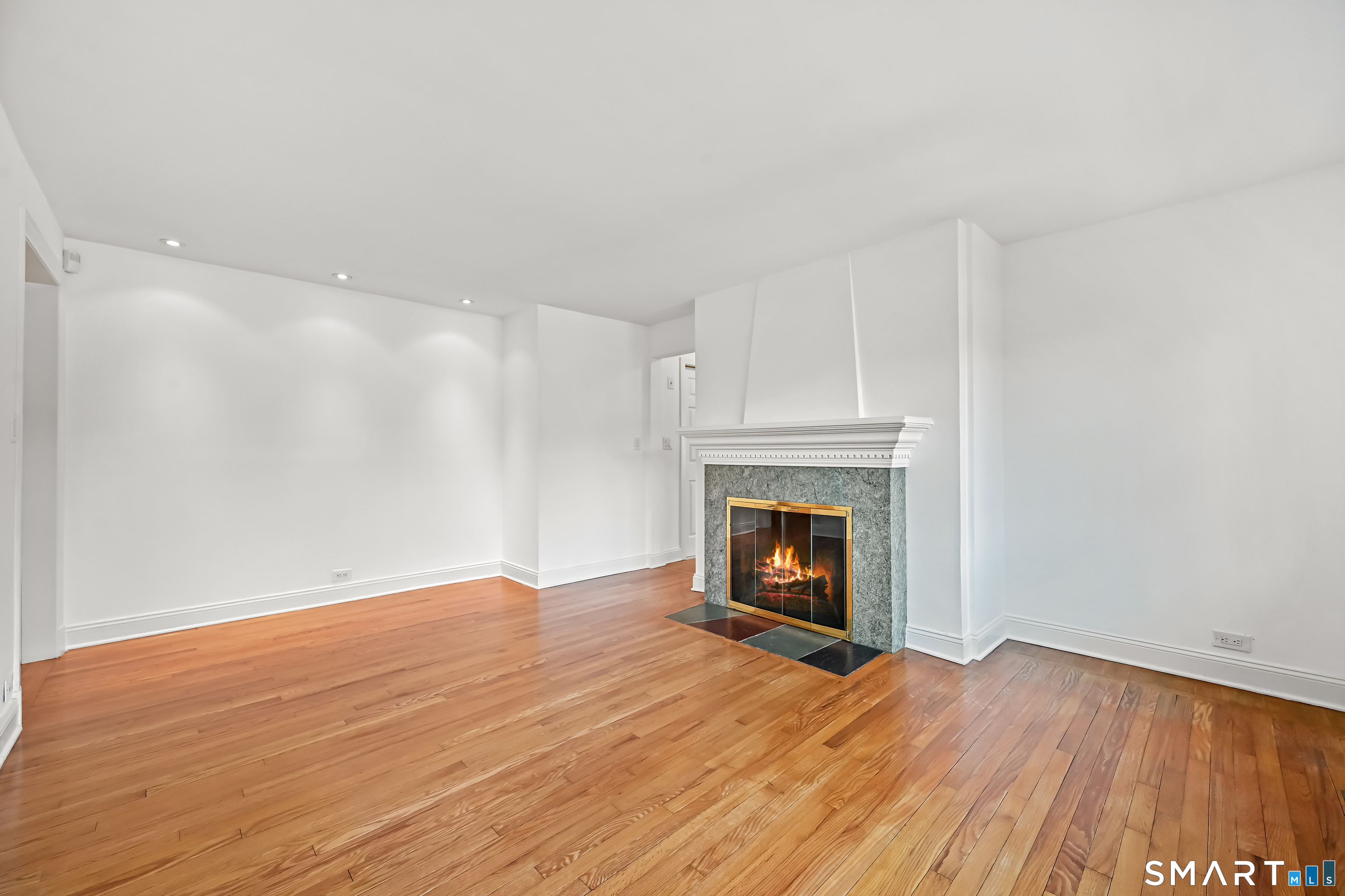 36 MacArthur Lane Stamford, CT 06902 - Photo 15 of 40 Main level Family Room with fireplace