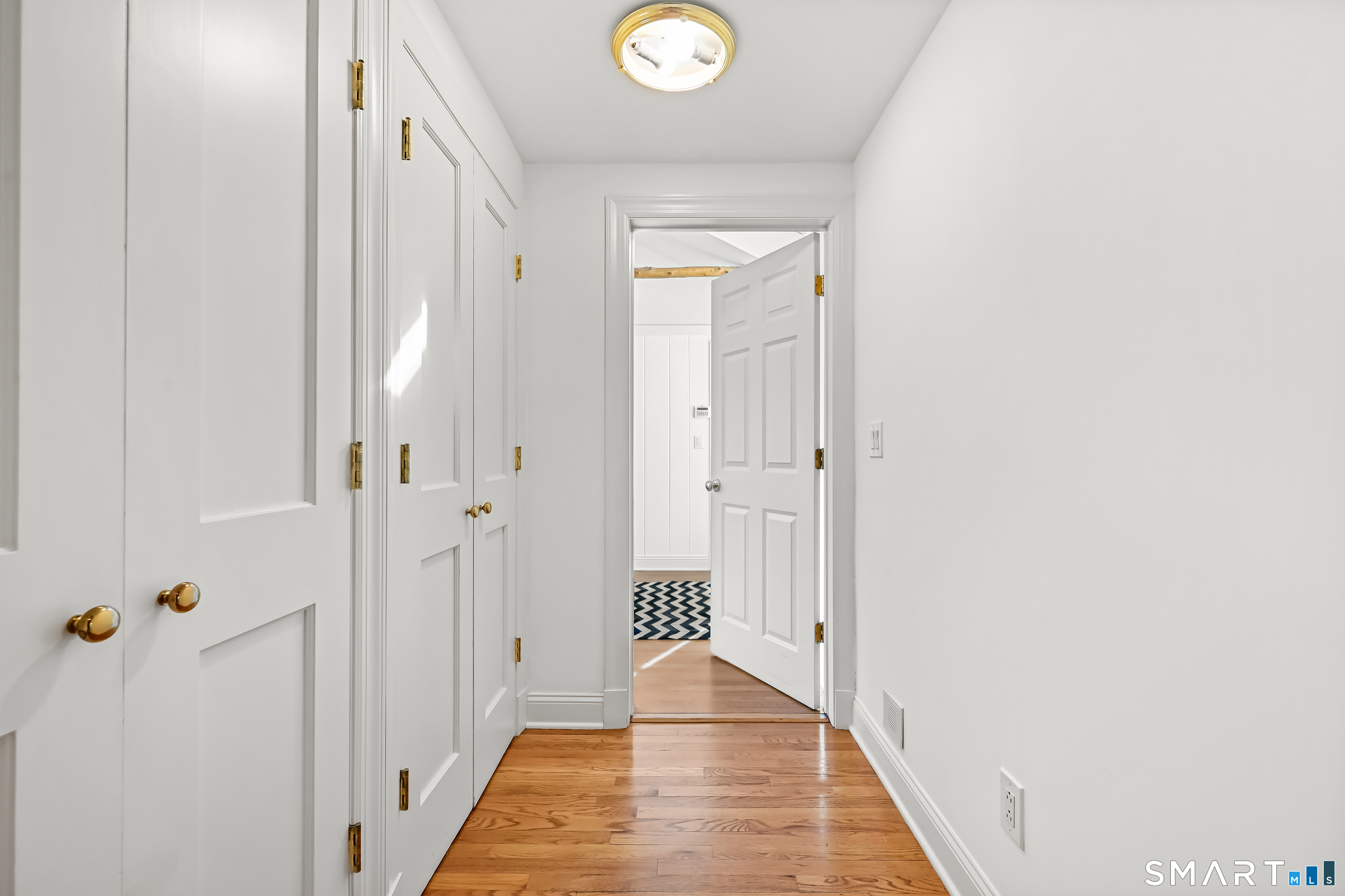 36 MacArthur Lane Stamford, CT 06902 - Photo 16 of 40 Hallway off of Entry with 2 double closets leads to Office