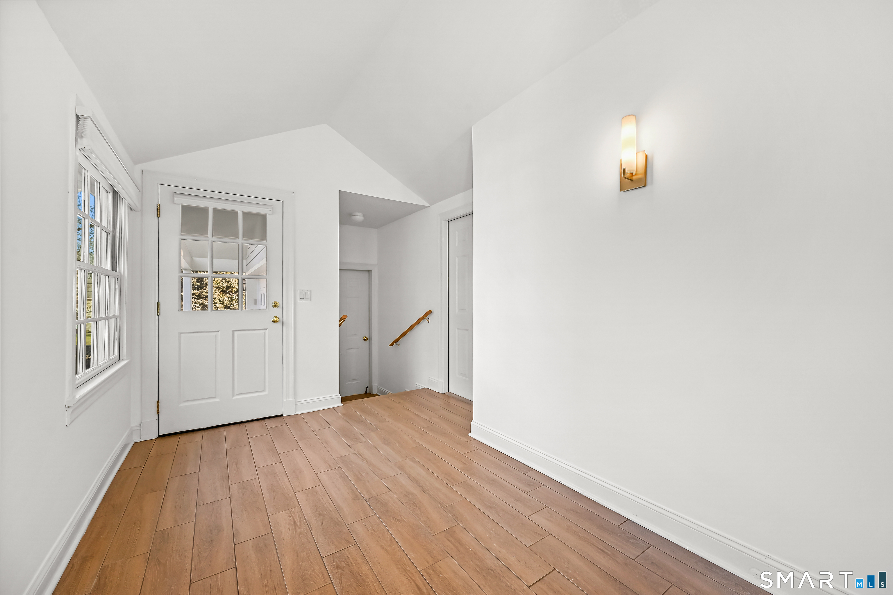 36 MacArthur Lane Stamford, CT 06902 - Photo 27 of 40 Back Hallway with great Mud Room space, leads to 2 Car Garage, Storage/Workroom/Shed and Powder Room