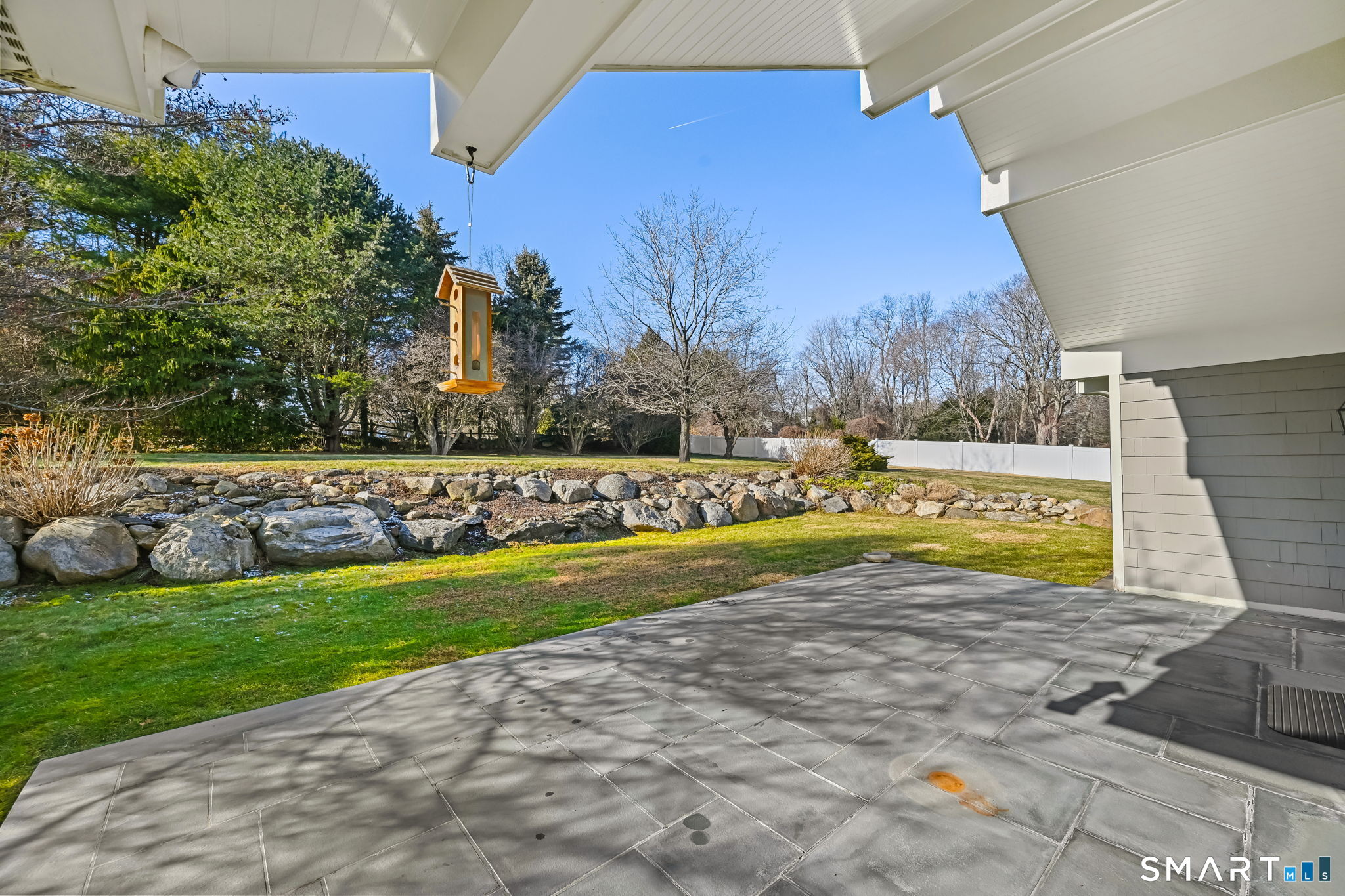 36 MacArthur Lane Stamford, CT 06902 - Photo 35 of 40 Bluestone Patio overlooks stone wall and lovely yard