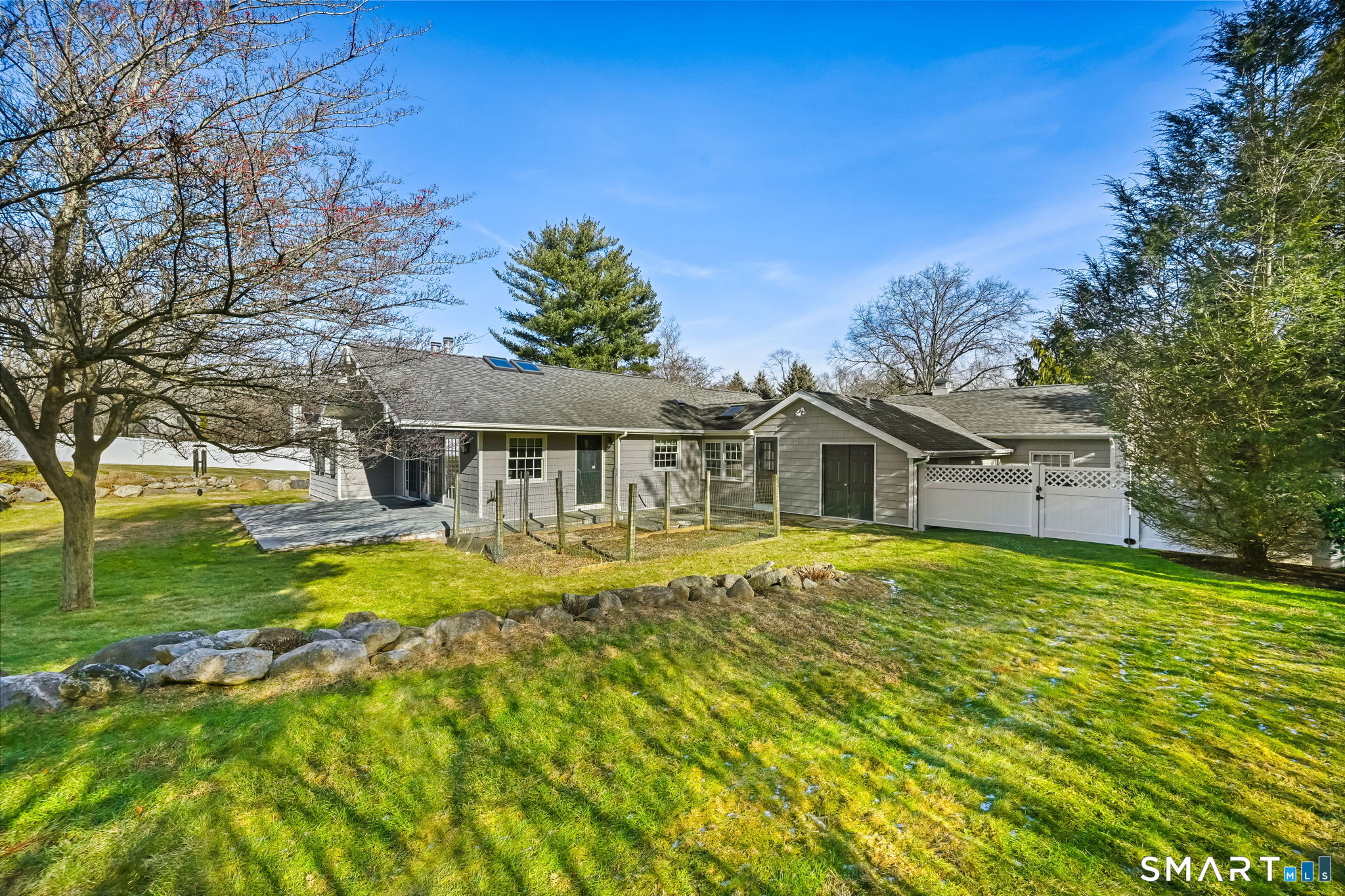 36 MacArthur Lane Stamford, CT 06902 - Photo 37 of 40 Side view of yard with fenced in vegetable garden area