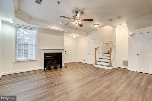 a view of a kitchen with a dishwasher cabinets and wooden floor