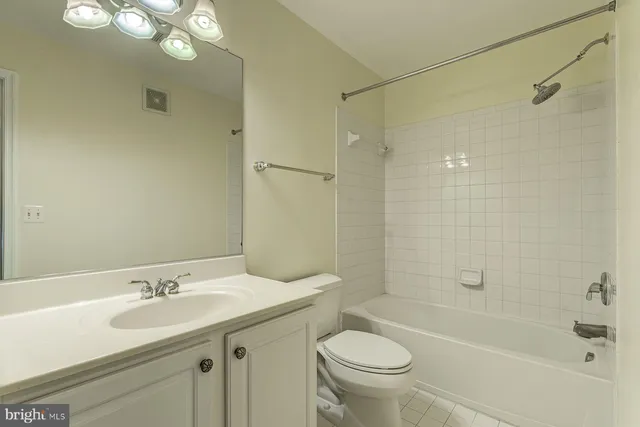 a kitchen with granite countertop a sink and cabinets