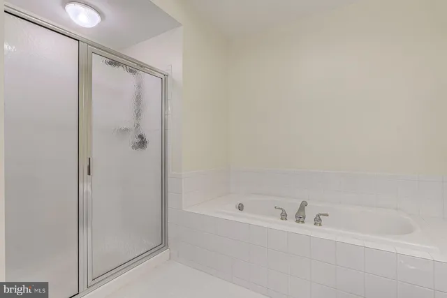 a kitchen with stainless steel appliances a cabinets and a stove top oven