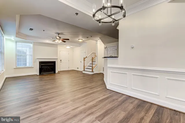 a view of a room with wooden floor