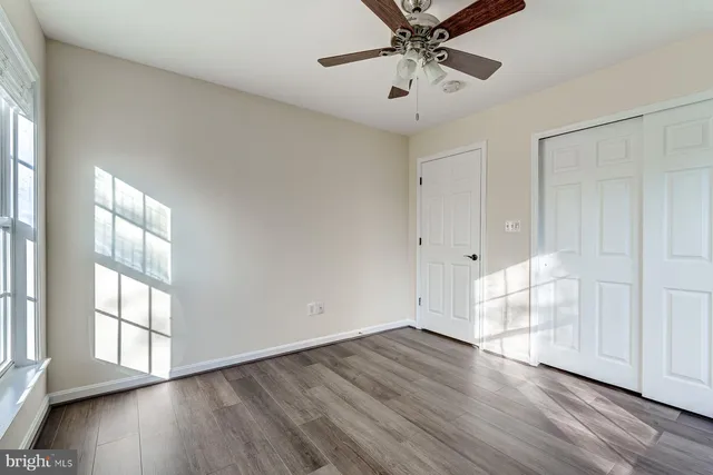 a bathroom with a double vanity sink and a toilet