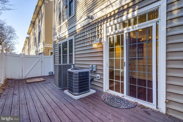 a view of a house with a wooden deck