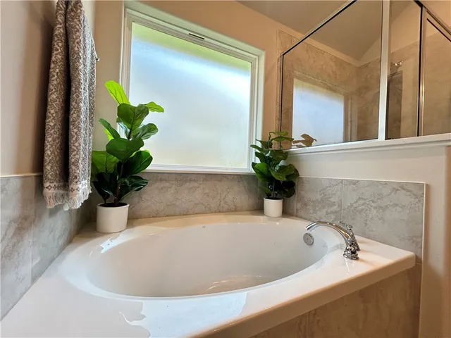 a white bath tub sitting in a bathroom