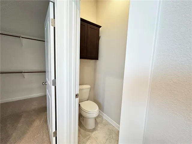 a bathroom with a toilet
