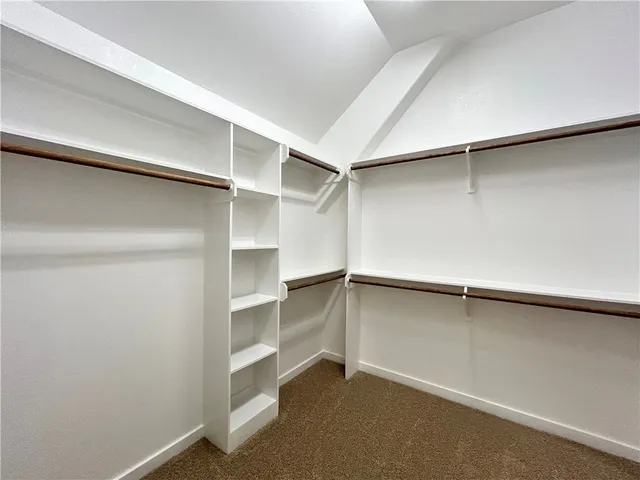 a view of an empty walk in closet