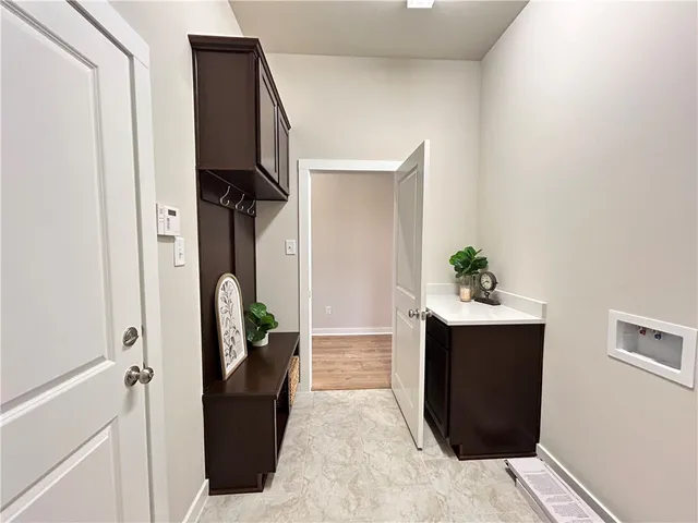 a room with painting and a wooden door