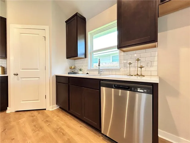 a bathroom with a sink vanity and mirror