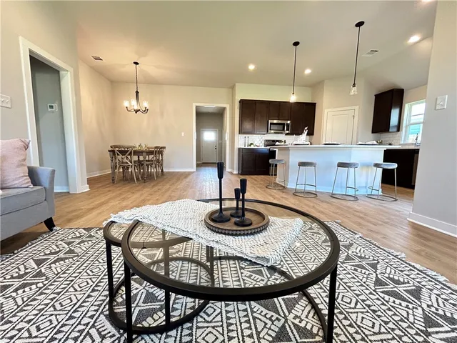 a kitchen with a dining table and chairs